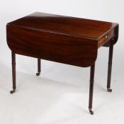 A Regency mahogany Pembroke table, with D shaped drop leaves, end drawer with dummy drawer to the