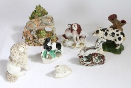 A collection of Staffordshire animals, to include a zebra, pig, spaniels etc., (7)