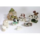 A collection of Staffordshire animals, to include a zebra, pig, spaniels etc., (7)