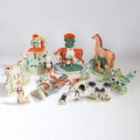 A collection of 19th century Staffordshire figures, to include four spill vases, a pepperette