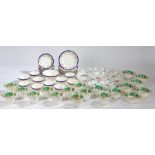 A porcelain hors d'oeuvres set comprising central circular dish and four fan shaped dishes, all with