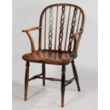 A 19th Century high back Windsor armchair, the arched back with turned spindles and pierced
