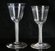 Two 18th Century air twist glasses, the larger with oval slice cut bowl and clear glass twist stem ,