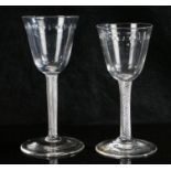 Two 18th Century air twist glasses, the larger with oval slice cut bowl and clear glass twist stem ,