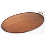 A Victorian mahogany oval tray, with brass carrying handles, 69.5cm wide, 48cm deep TRANSFER