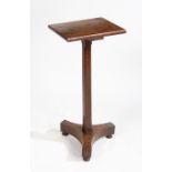 A 19th Century oak occasional table, the rectangular top raised on a square chamfered stem, tripod