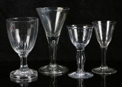 Four 18th Century glasses, to include a rummer with slice cut bowl and octagonal stem and foot, a