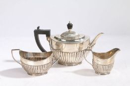 A Victorian silver three piece tea set, Sheffield 1895, maker John Round & Son ltd. consisting of