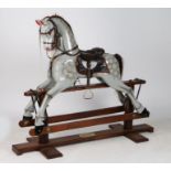A 20th Century rocking horse, the dappled grey horse with horse hair mane and tail, the frame with