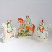 A pair of 19th century Staffordshire Scottish figures, in the form of musicians on horseback, and