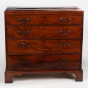 A George III mahogany and boxwood strung chest of four long drawers, with brass swan neck handles,