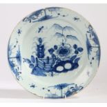 An 18th century Chinese charger, the bowl centred with a landscape, unmarked, 34cm diameter