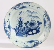 An 18th century Chinese charger, the bowl centred with a landscape, unmarked, 34cm diameter