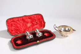 A pair of Victorian silver pepperettes, London 1898, maker Joseph Walton, with domed tops and