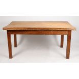 An estate made kitchen table, the substantial rustic oak plank top raised on square legs, 152cm