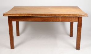 An estate made kitchen table, the substantial rustic oak plank top raised on square legs, 152cm