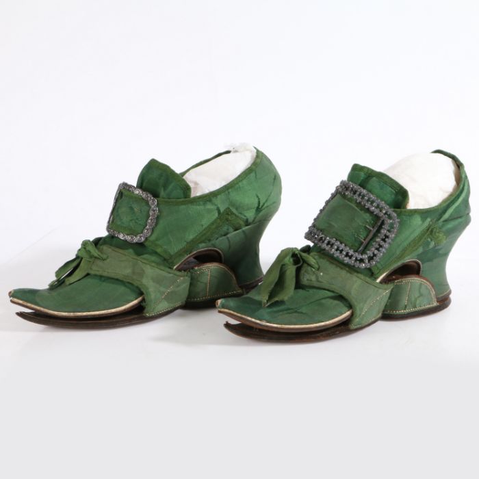 A fine pair of silk damask shoes, circa 1730 of dark green silk edged in green braid, with white