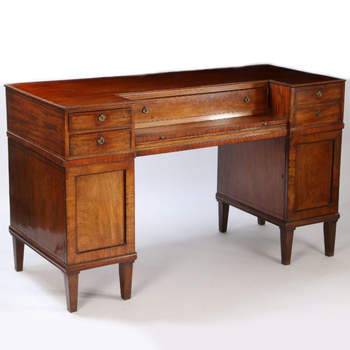 An Good Edwardian twin pedestal sideboard having a breakfront top with boxwood stringing above three