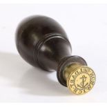 Geldart Norwich desk seal, the turned lignum vitae handle above a brass matrix with central fouled
