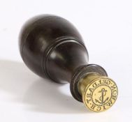 Geldart Norwich desk seal, the turned lignum vitae handle above a brass matrix with central fouled