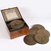 A late 19th century Symphonion Simplex German music box together with further discs. 12cm high and