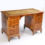 A 19th century dutch marquetry walnut desk, having a leather inset top with floral inlaid to the
