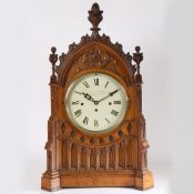 A 19th century oak cased Gothic bracket/table clock by A. Taffinder of Rotherham, having carved
