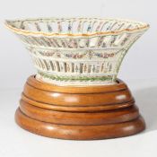 An early 20th century French 'Sevres' reticulated floral hand painted porcelain basket with