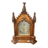 A 19th century oak cased Gothic bracket/table clock by James Gowland 52 London Wall City, the