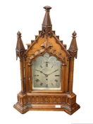 A 19th century oak cased Gothic bracket/table clock by James Gowland 52 London Wall City, the