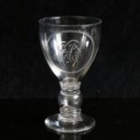 A glass ovoid bowl goblet with 1757 shilling in stem, circa 1790. Engraved with 'GAF' initials, 15cm