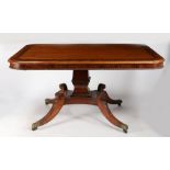 A Regency mahogany tilt top breakfast table, having a rectangular top inlaid with rosewood cross