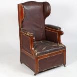 An Unusual 19th century reclining wing back library armchair