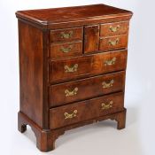 An Early 18th century walnut "Norfolk" chest of drawers, with a rectangular burr walnut top with