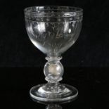 A glass ovoid goblet engraved 'R Strong 1809' with 1745 shilling in stem, circa 1800. Engraved