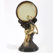 A large Art Nouveau style 'Erte Paris' bronze figure modelled as a female gazing into a circular