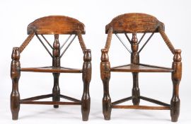 A pair of 18th century ash, beech and pine turner's chairs, English Each of three-post form, with