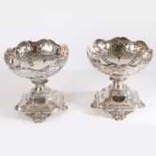 A pair of Edward VII decorative solid silver comports by Horace Woodward & Co, London 1901. They are