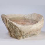 A large carved marble holy water font in the form of a clam shell, 56cm wide