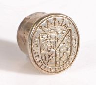 A white metal seal matrix, English, circa 1600, the oval matrix engraved with a coat of arms