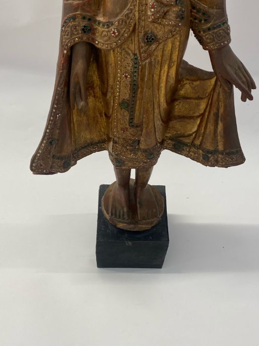 A 20th century gilt and lacquered carved Burmese standing Buddha - Image 2 of 2