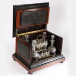 A 19th century gutta-percha mounted Tantalus box. The box has a birds eye maple exterior with