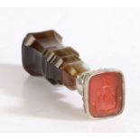 A late 19th Century hardstone and white metal desk seal, the mottled brown chamfered agate handle