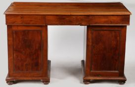 A George III yew wood pedestal desk, the four plank rectangular top above three drawers and two