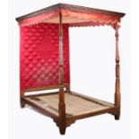 A 19th century Scottish mahogany tester bed having a red velvet tester with a wavy frilled edge