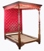 A 19th century Scottish mahogany tester bed having a red velvet tester with a wavy frilled edge