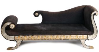 A Regency style chaise long, having a silvered scroll reeded body with a gilt floral frieze,