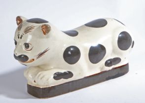 A Chinese Cizhou style stoneware 'cat' pillow, probably late Qing Dynasty, 33cm long