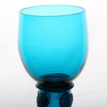 An English 18th Century blue roemer glass, circa 1770, the tall cup with multi applied raspberry