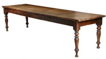A large 19th century walnut farmhouse kitchen table, English, having a rectangular top above